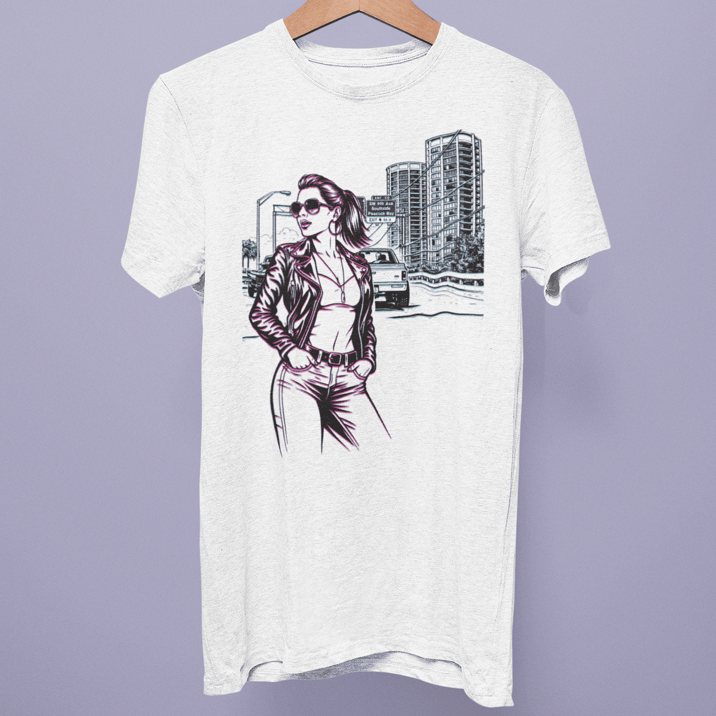 Front view of the Grand Theft Auto Collection T-shirt on a hanger, showing city street artwork with a woman, car and urban skyline on white fabric.