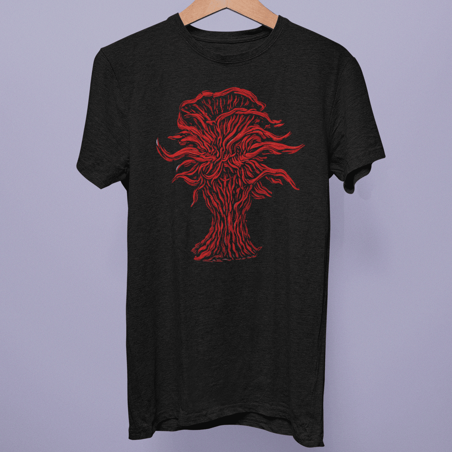Front view of the Enshrouded Collection T-shirt on a hanger, showing red corrupted tree artwork on black fabric.