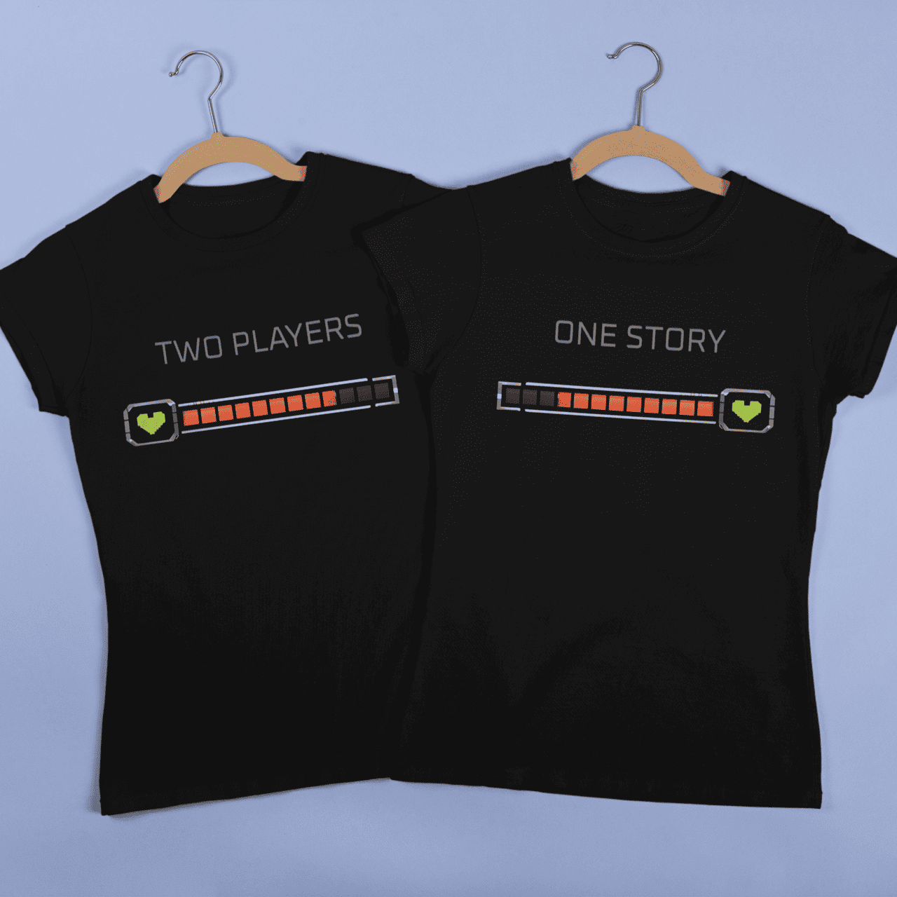 Front view of Gamer Couple Apparel – Playing Together, showing two matching black T-shirts with player health bar artwork.