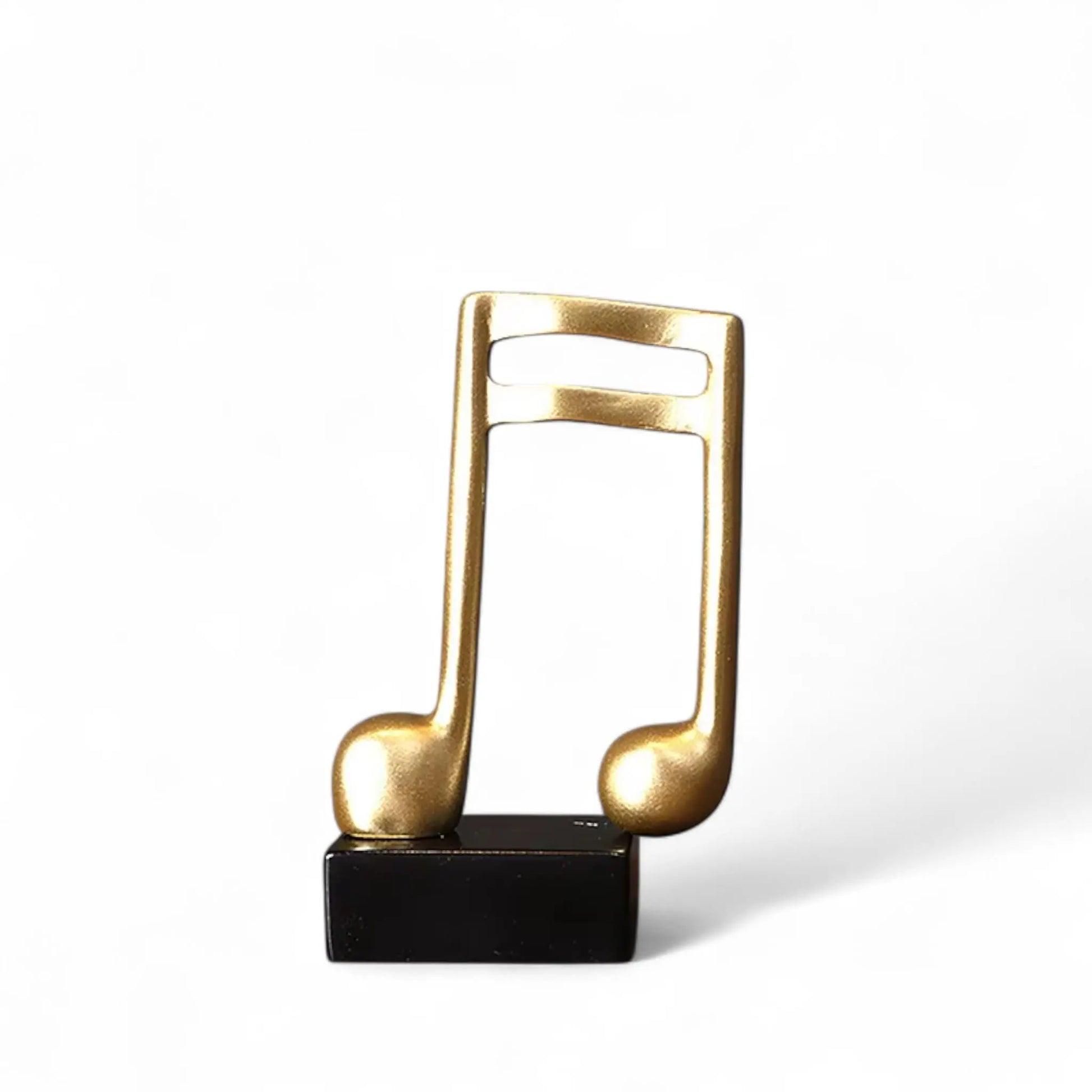 Musical Note Resin Sculpture – Elegant Gold Figurine for Home & Studio Decor  Geniogoods