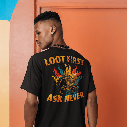 Person wearing a black t-shirt with colorful text and graphics, standing against an orange wall.