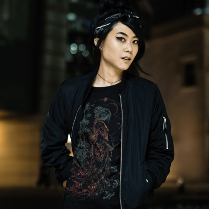 Female model in Female Samurai T-Shirt with detailed warrior artwork during a cinematic city night scene.