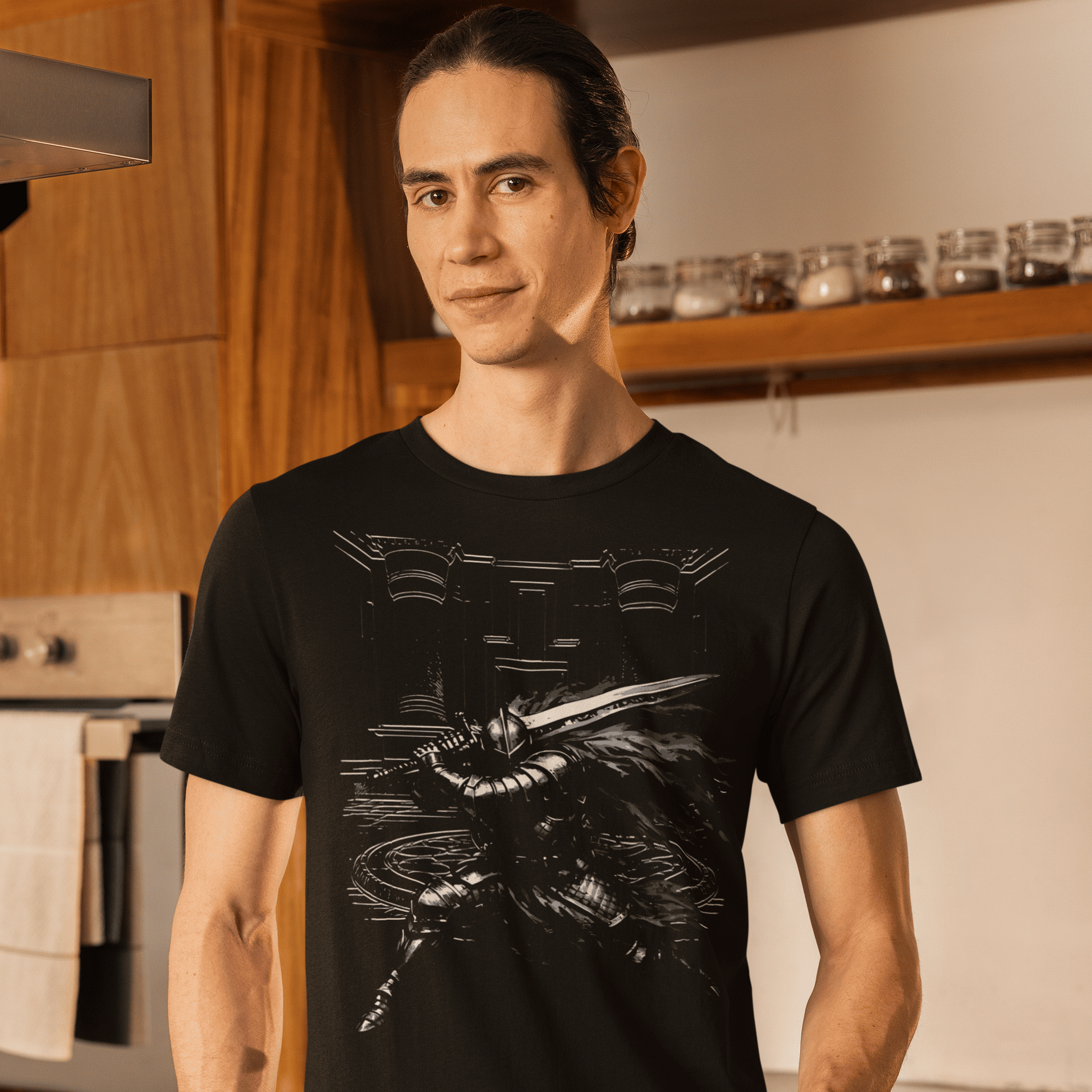 Man wearing a black t-shirt with a graphic design in a kitchen