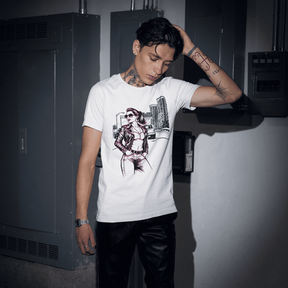 Person wearing a white t-shirt with a graphic design in a dimly lit room.