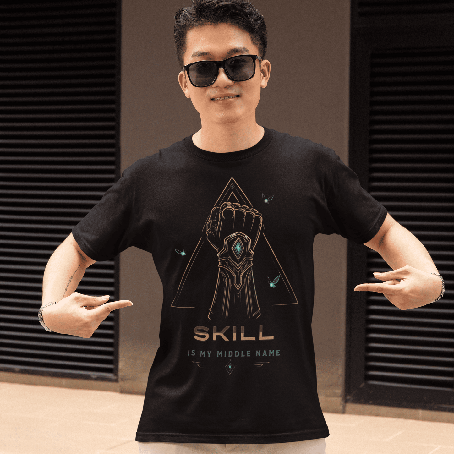 Front view of Skill Is My Middle Name Gamer T-Shirt with Fantasy Power Art worn by a model pointing at the design