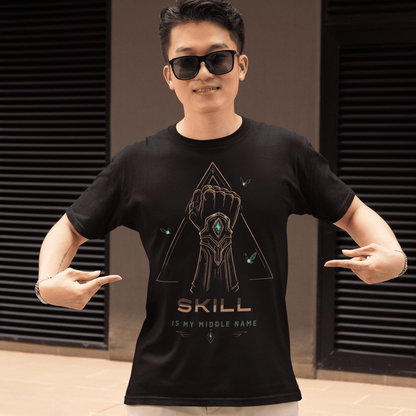 Front view of Skill Is My Middle Name Gamer T-Shirt with Fantasy Power Art worn by a model pointing at the design