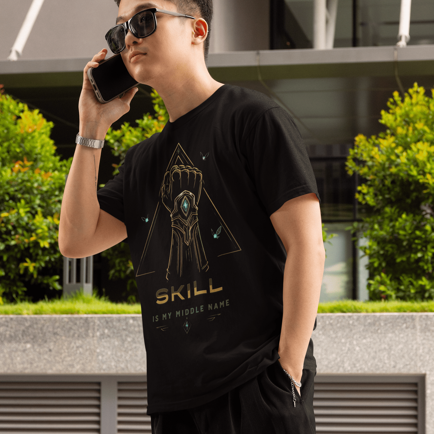 Front view of Skill Is My Middle Name Gamer T-Shirt with Fantasy Power Art worn by a model with one hand in pocket