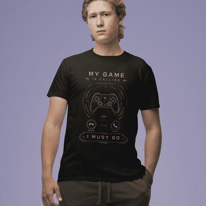 Full body front view of My Game Is Calling T-Shirt – I Must Go Gamer Mood worn by a model on a purple backdrop