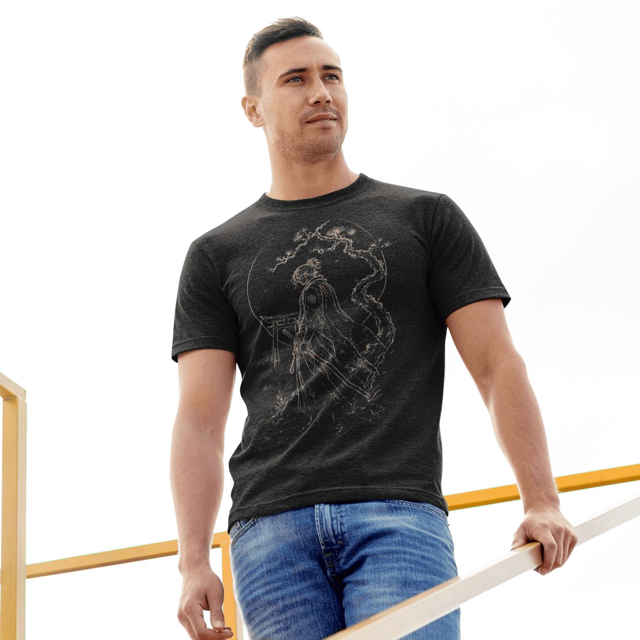 Male model wearing Torii Samurai T-Shirt with quiet samurai artwork on an outdoor stairway.