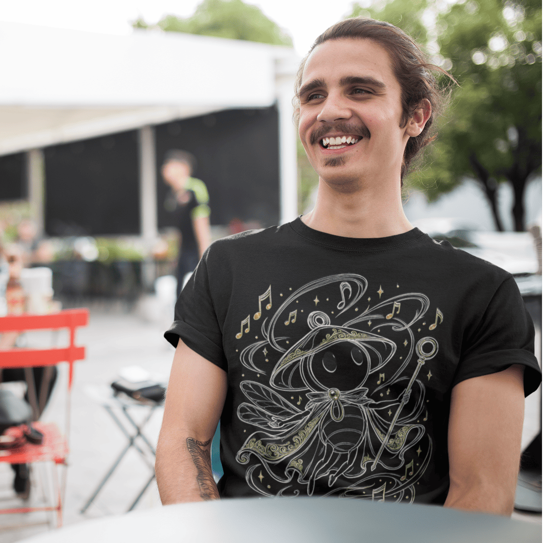 Outdoor front view of Sherma Wandering Melody T-Shirt – Silksong Fan Art worn in a casual street setting