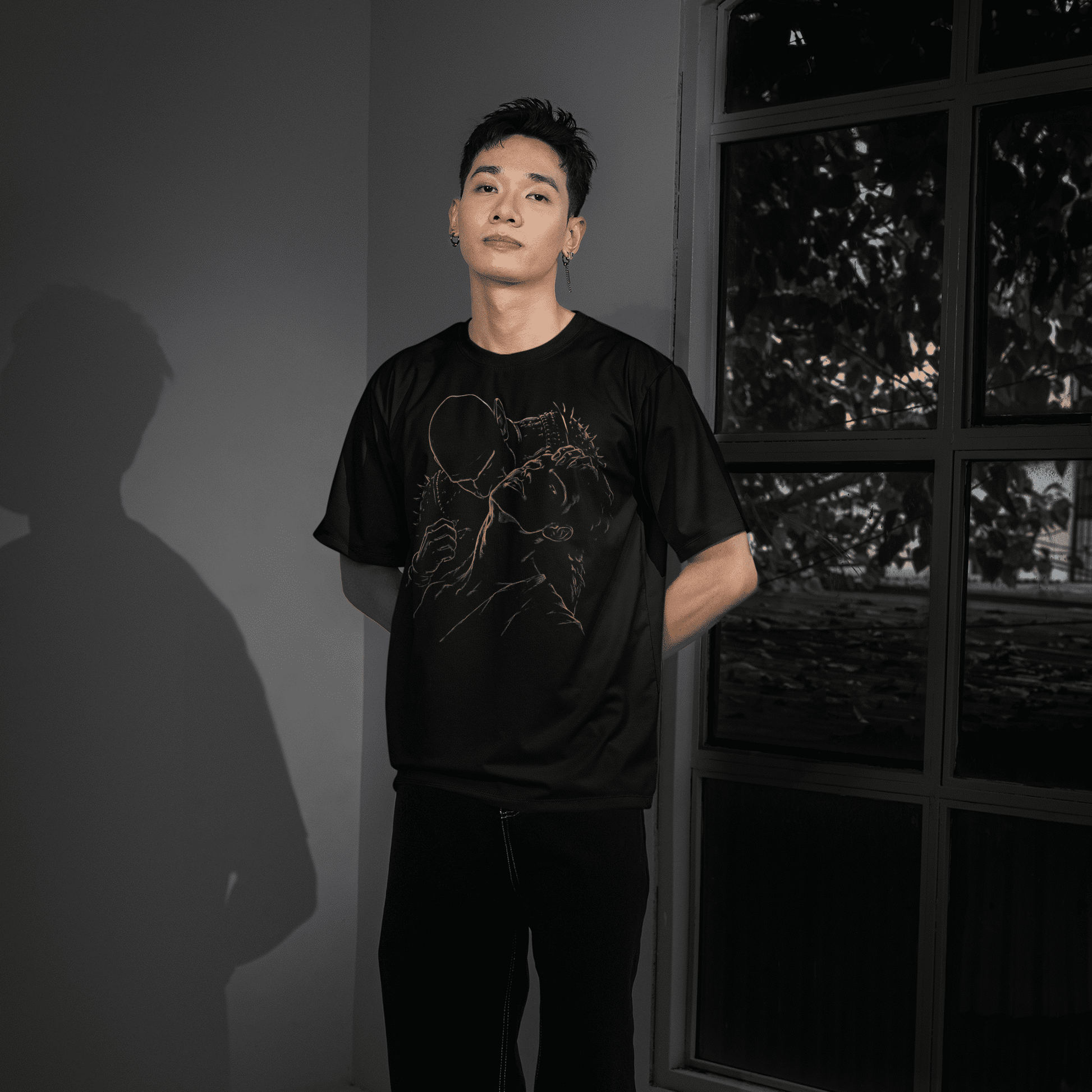Full-length model wearing The Blood of Dawnwalker Sire Embrace T-Shirt with dark vampiric line art on a black tee.
