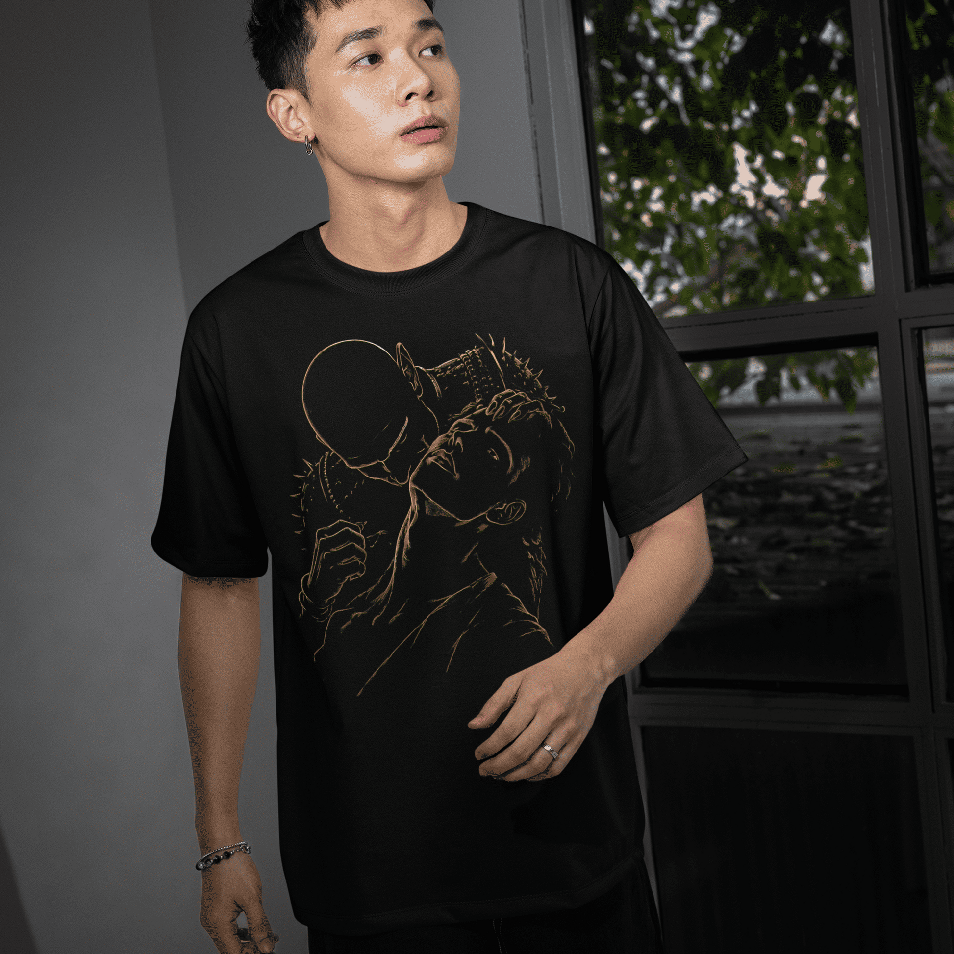 Front lifestyle view of a model wearing The Blood of Dawnwalker Sire Embrace T-Shirt with gold gothic vampire artwork.