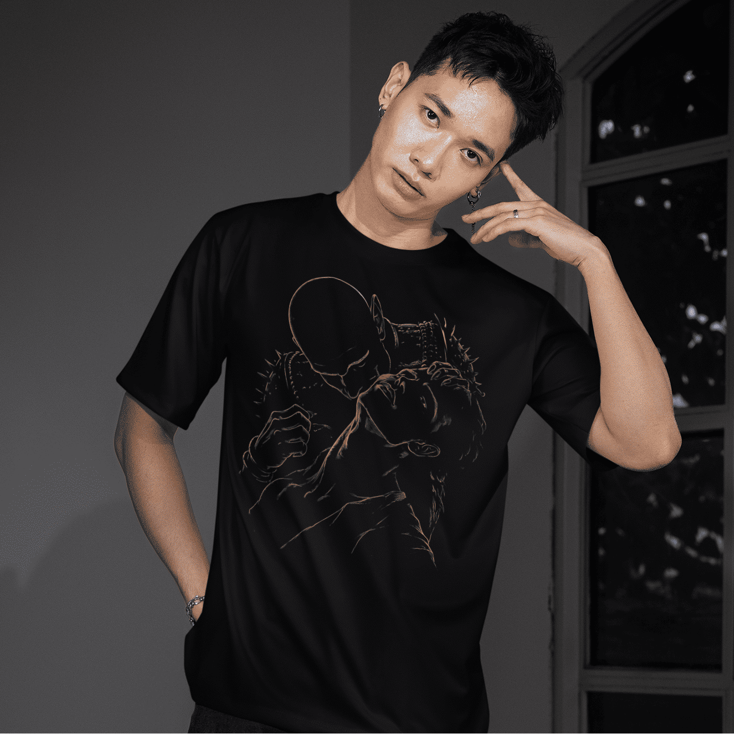 Full-body model view of The Blood of Dawnwalker Sire Embrace T-Shirt showing the front gold artwork on a black tee.