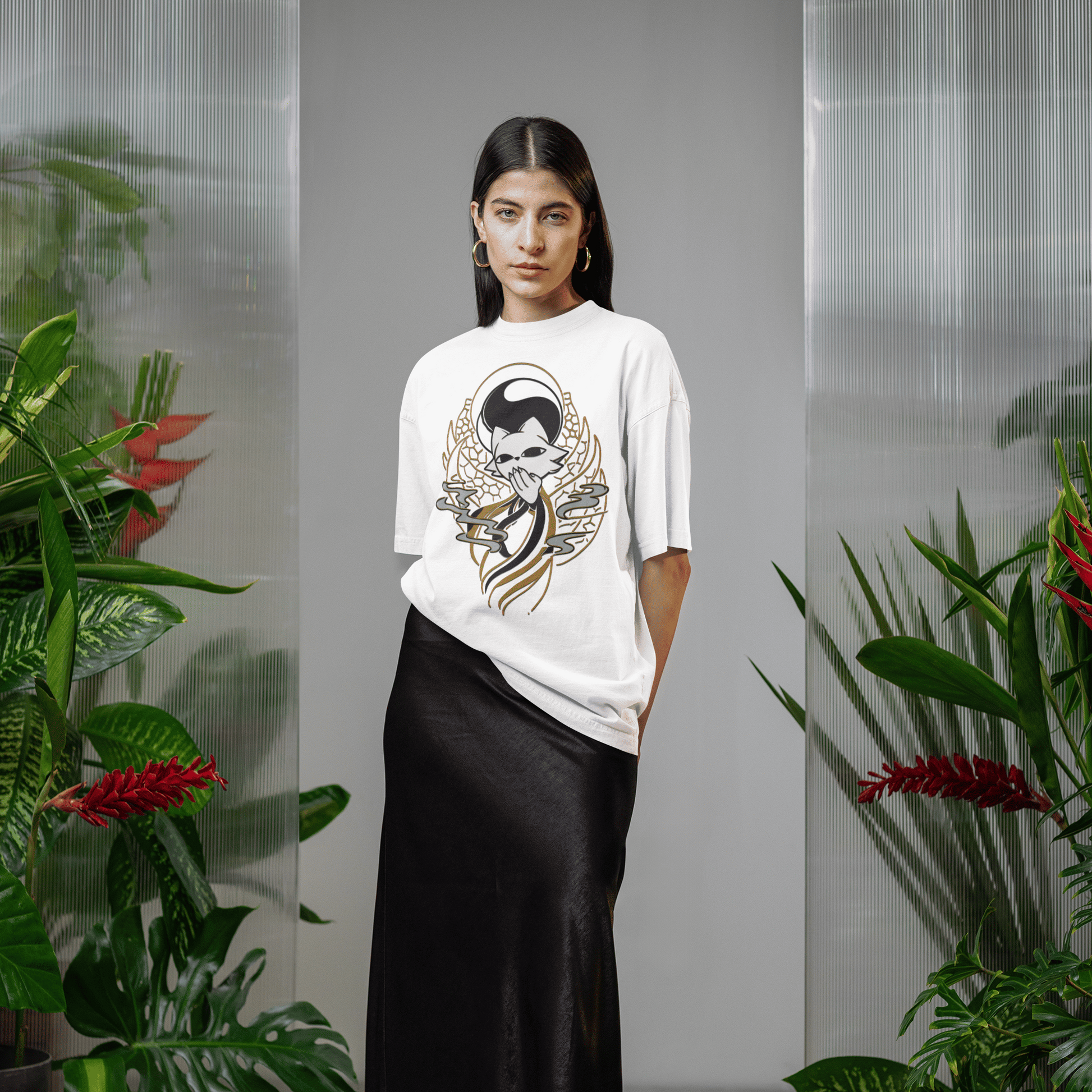 Full-body view of a female model wearing the white Nine Sols Yin Yang Tee – Balance Presence in an indoor plant-filled setting.