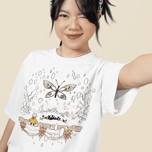 Close-up lifestyle image of a model wearing the white Nine Sols Butterfly Tee – Golden Echo with a soft smile.