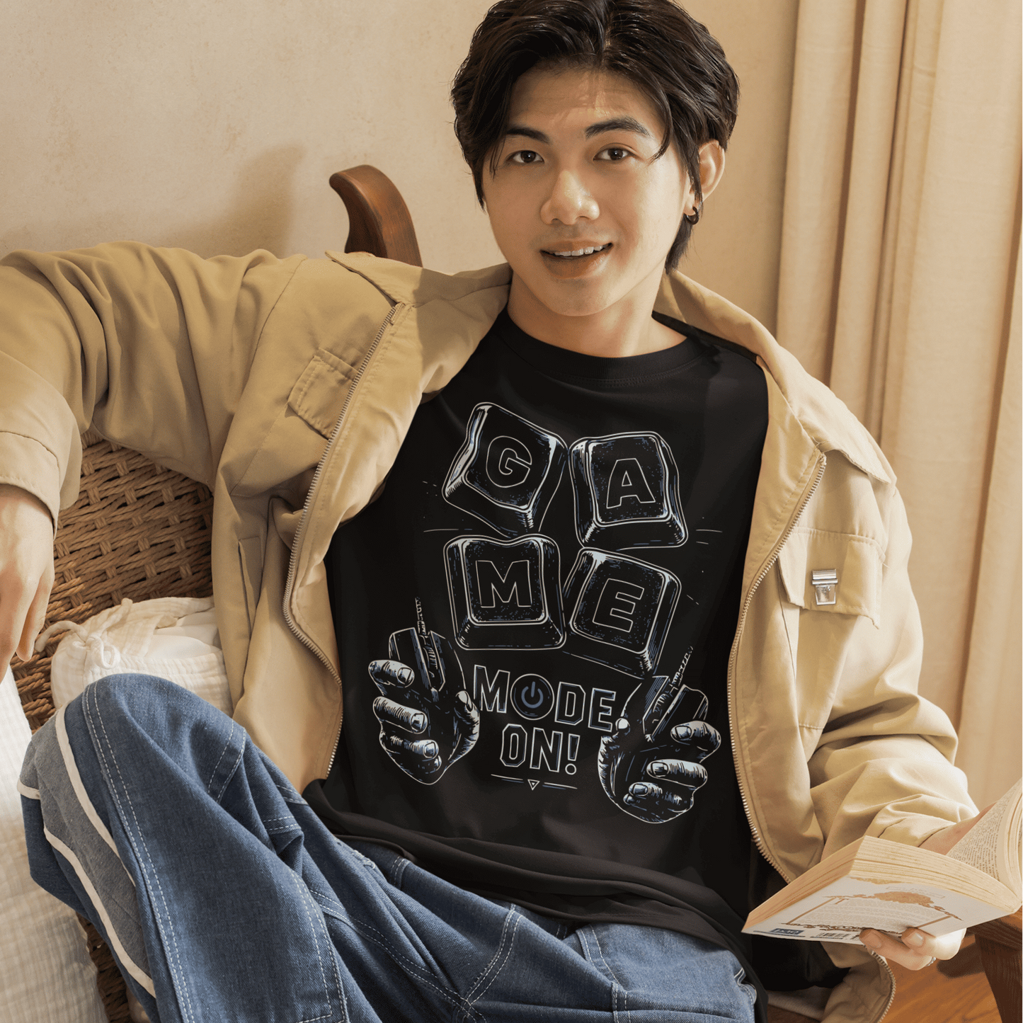 Male gamer relaxing in Game Mode On T-Shirt with setup-inspired artwork in a cozy bedroom gaming scene.