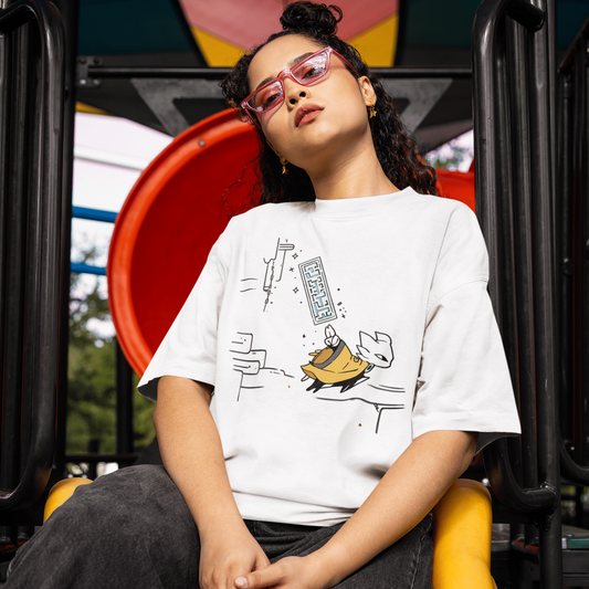 Front view of a model wearing the white Nine Sols Action Tee – Seal Motion while seated on a playground slide.