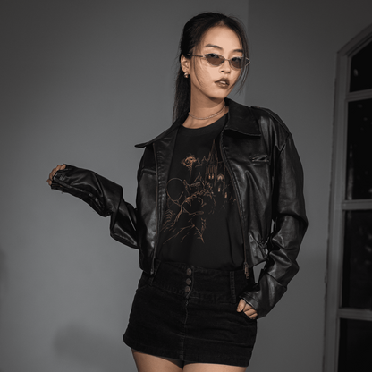 Front lifestyle view of The Blood of Dawnwalker Sire Domain T-Shirt styled with a black jacket and skirt.
