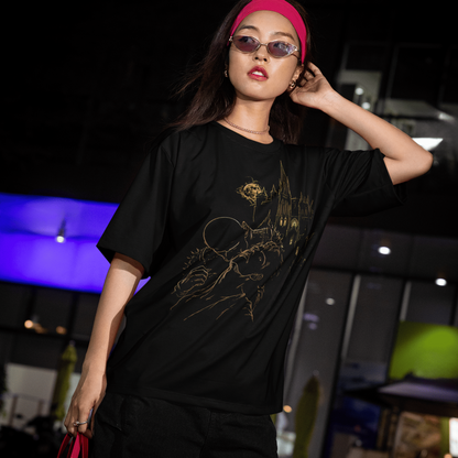 Night lifestyle model view of The Blood of Dawnwalker Sire Domain T-Shirt with gold vampire and castle artwork on a black tee.