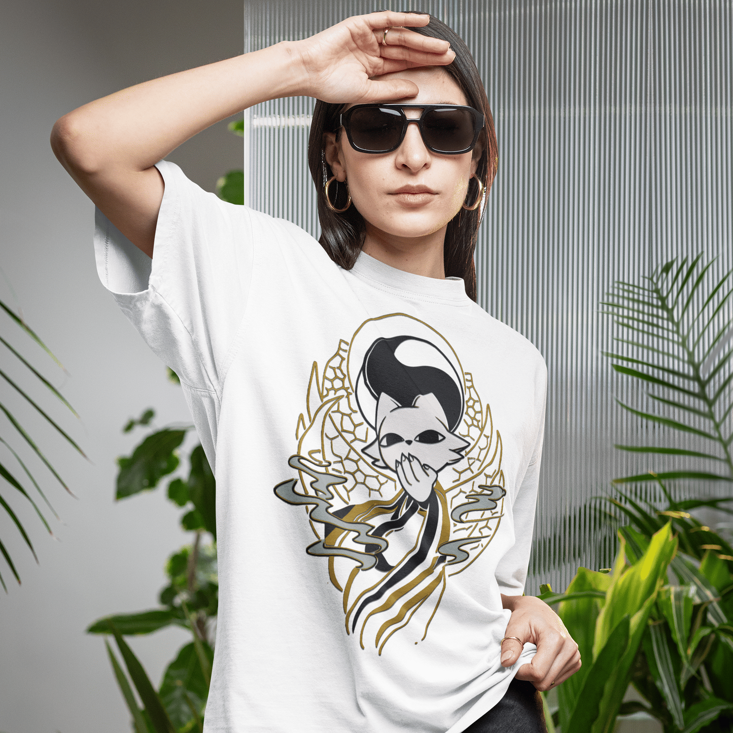 Lifestyle image of a female model wearing the white Nine Sols Yin Yang Tee – Balance Presence in a lush botanical setting.