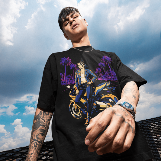 Person wearing a black t-shirt with a graphic design against a cloudy sky.