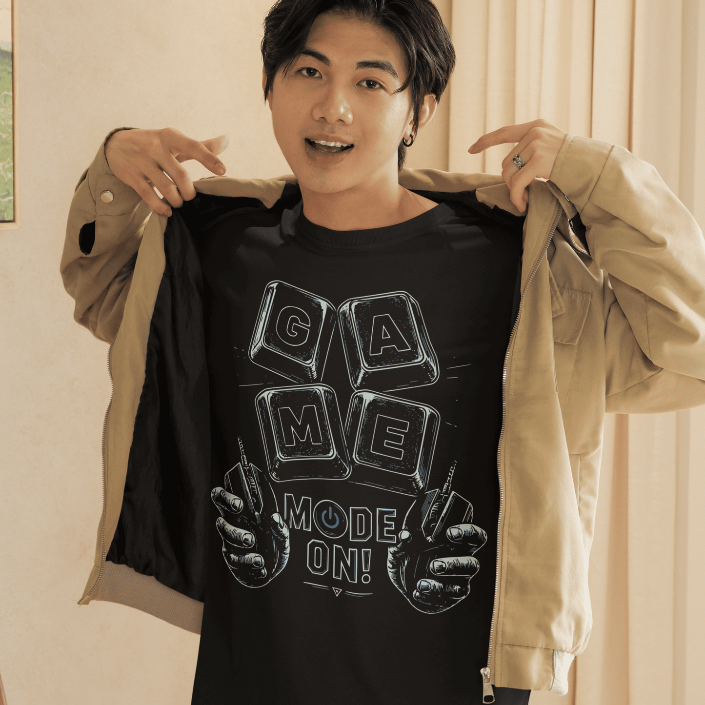 Male model showing his Game Mode On T-Shirt with gaming setup artwork in a bright indoor lifestyle setting.