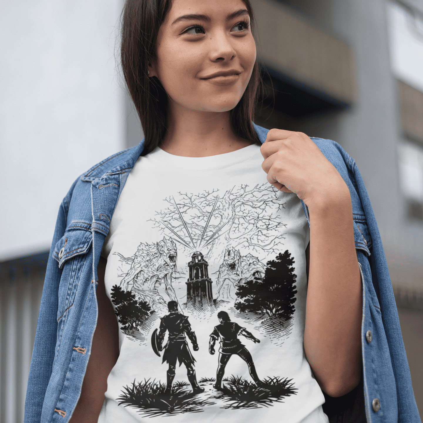 Person wearing a white t-shirt with black graphic design outdoors