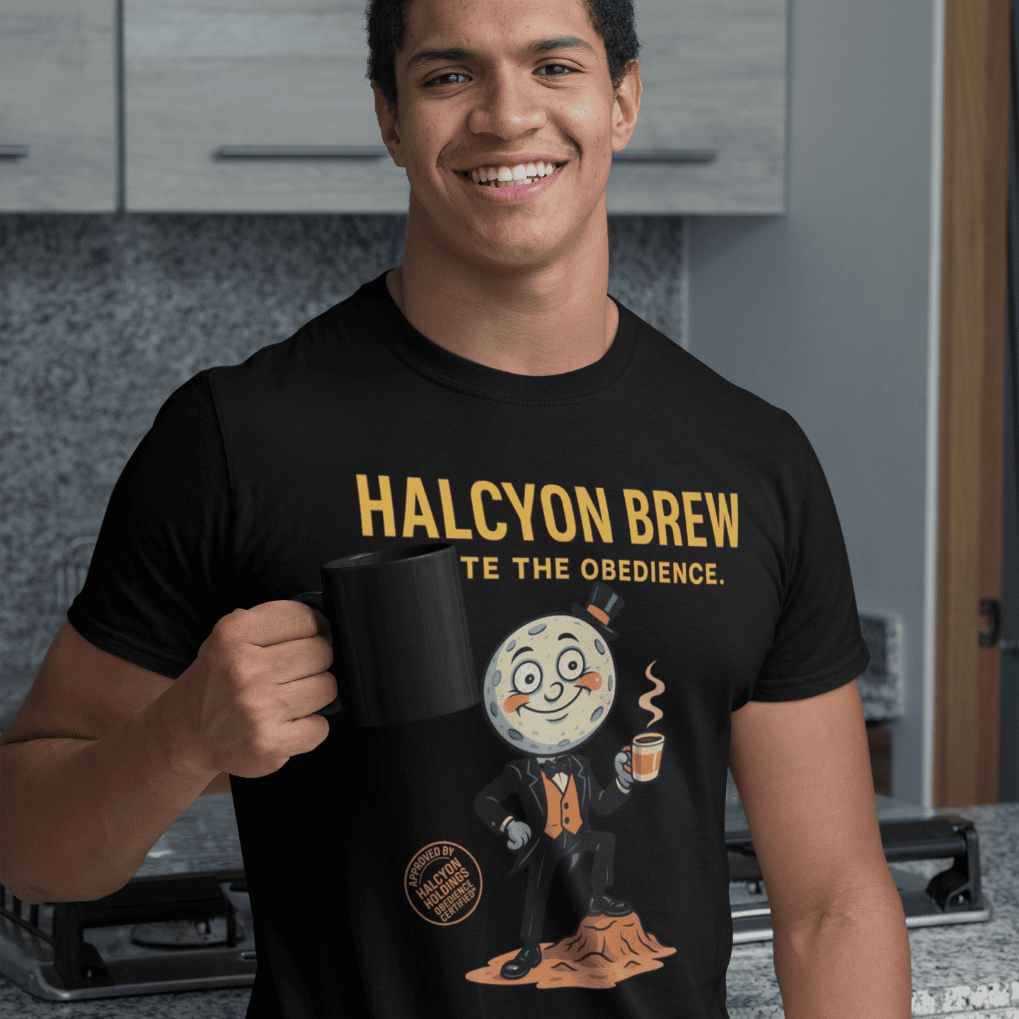 Model wearing The black Outer Worlds 2 Halcyon Brew T-Shirt showing front graphic while holding a mug in a kitchen 