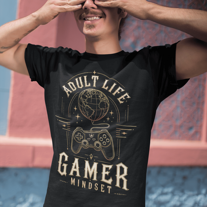 Male gamer covering his eyes in Adult Life Gamer Mindset T-Shirt with retro gaming graphic in an urban setting.