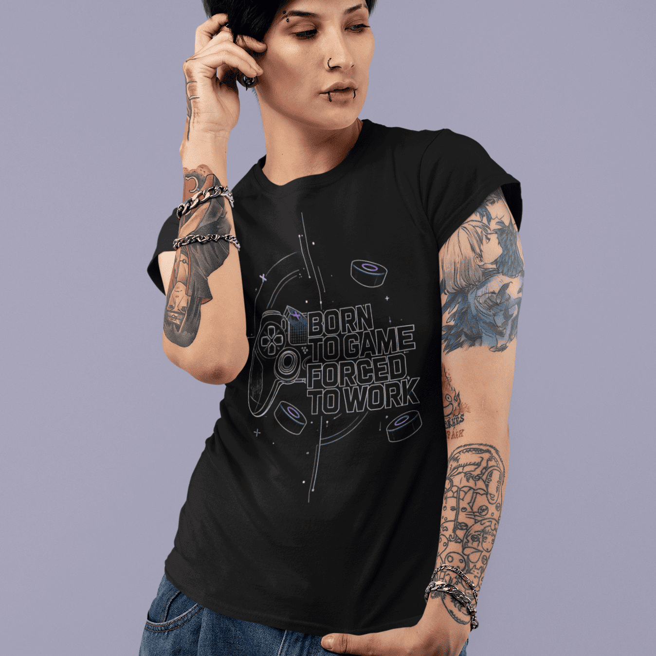 Front view of Born to Game Forced to Work Gamer T-Shirt worn by a model on a purple backdrop