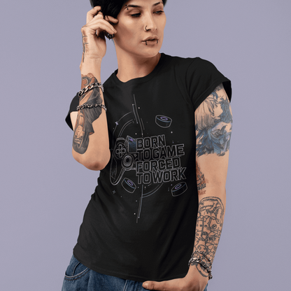 Front view of Born to Game Forced to Work Gamer T-Shirt worn by a model on a purple backdrop