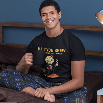 Model wearing The black Outer Worlds 2 Halcyon Brew T-Shirt showing front print while sitting on a bed with a mug