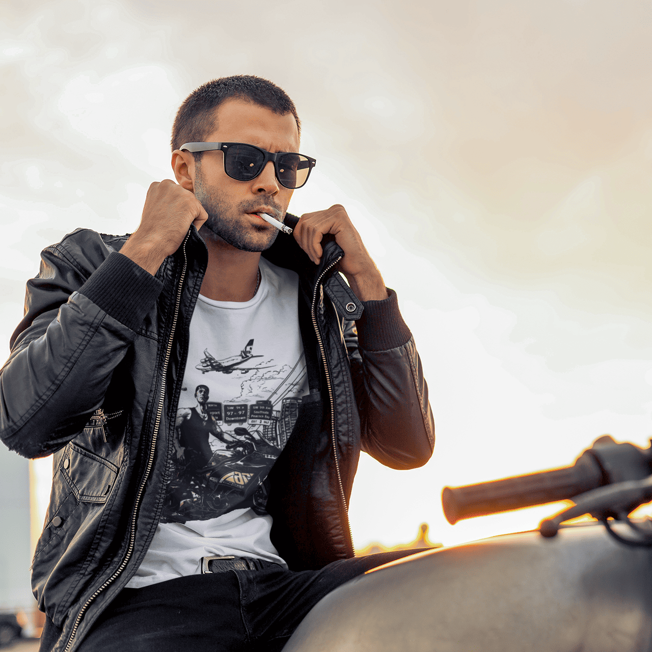 Man sitting on a motorcycle wearing sunglasses and a leather jacket with a blurred background
