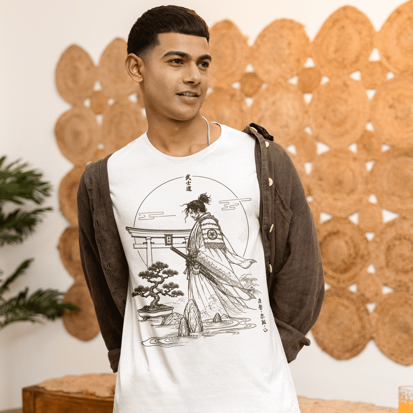 Male model reclining on a sofa in Bushido Samurai T-Shirt with quiet warrior artwork and relaxed lifestyle styling.