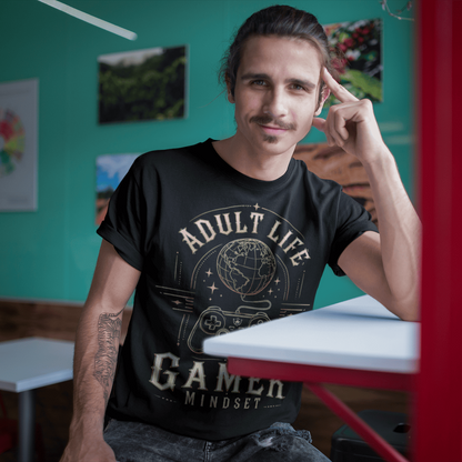Male gamer resting by a window in Adult Life Gamer Mindset T-Shirt featuring everyday gaming lifestyle artwork.