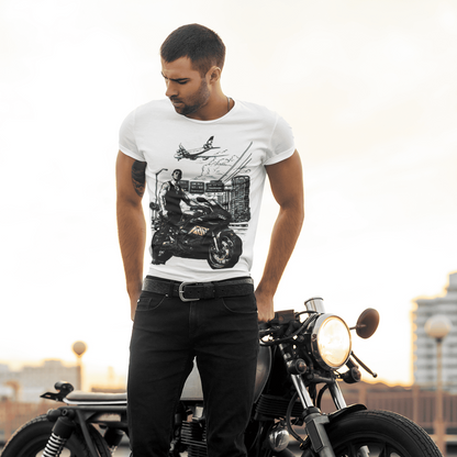 Man wearing a white t-shirt with a graphic design, standing next to a motorcycle.