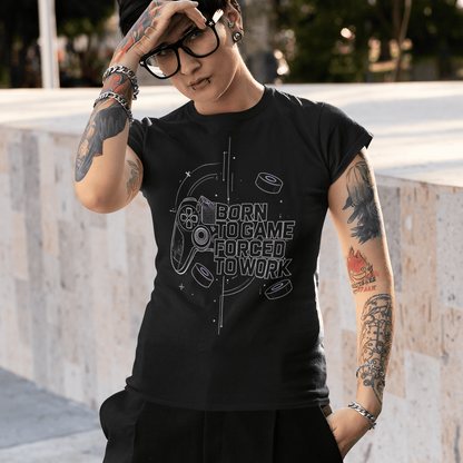 Outdoor view of Born to Game Forced to Work Gamer T-Shirt worn by a model shading their eyes