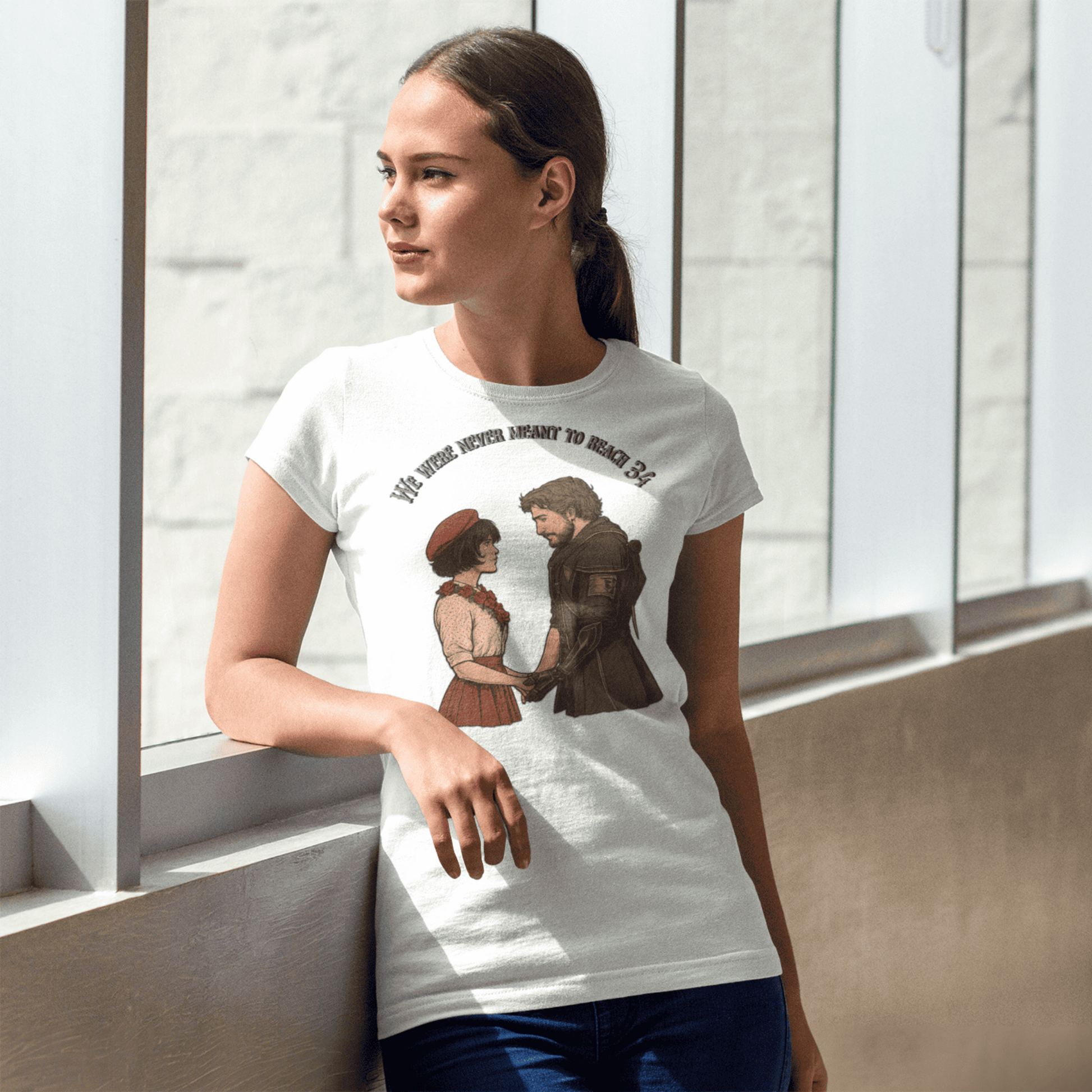 Woman wearing a white t-shirt with a graphic design of three people hugging, standing in a modern indoor setting.