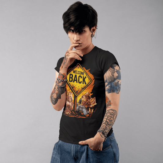 Person wearing a black t-shirt with a graphic design and blue jeans on a gray background