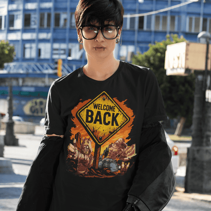 Person wearing a black t-shirt with a 'Welcome Back' graphic design outdoors.