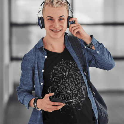 Front view of Born to Game Forced to Work T-Shirt – Headset Gamer Mode worn by a model adjusting headphones