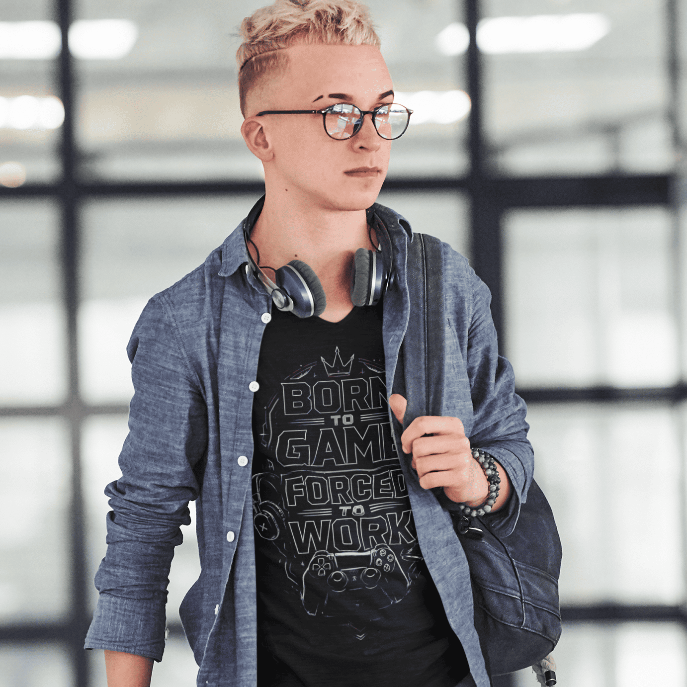 Full body view of Born to Game Forced to Work T-Shirt – Headset Gamer Mode worn with backpack and headphones